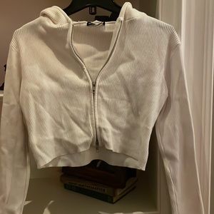 Brandy Melville beige ribbed cropped zip up sweater with hood.